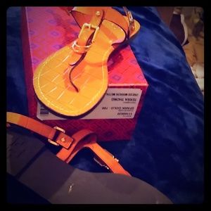A pair of Orange Tory Burch Sandals